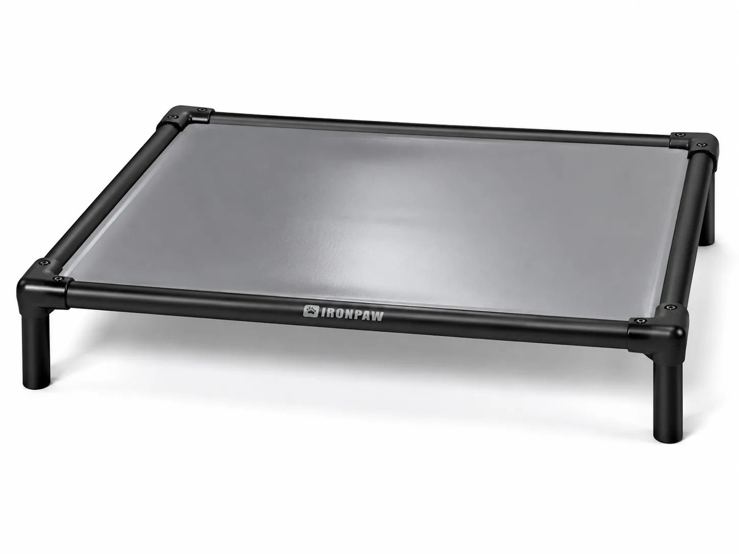 Commercial studio product photo of the IronPaw Slate elevated dog bed with glossy neutral mid-grey PVC fabric, matte black aluminium frame, rounded corner connectors, bare tube legs, and a pale laser-engraved IronPaw logo centred on the long front rail.